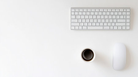 White office desk table with keyboard, mouse and coffee cup. Top view with copy space, flat layの素材