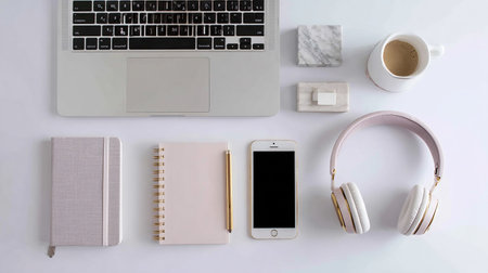 Laptop, headphones, notebook and coffee cup on white background.の素材