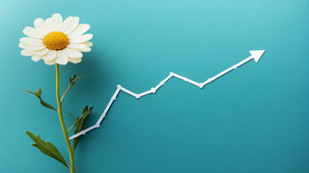 Chamomile flower and growing graph on blue background. Business conceptの素材