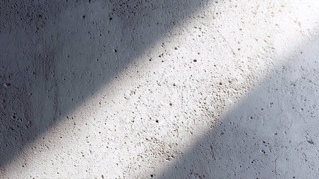 White concrete wall with sunlight and shadow. Abstract background and texture for design.の素材