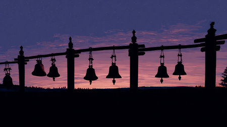 Silhouette of bells on the bridge in the night sky.の素材