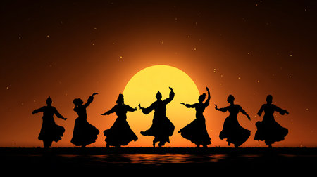 Silhouette of a group of Indian dancers dancing at sunset.の素材