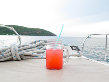 Colorful cocktail drink on  sea  sky backgroundの写真素材