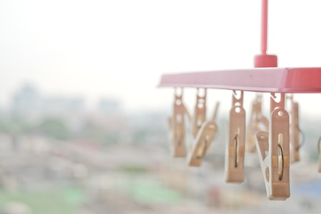 Many plastics clothes pin on washing lineの写真素材