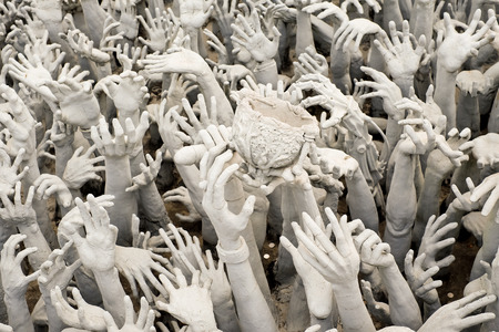 Hands Statue from Hell in Wat Rong Khun at Chiang Rai, Thailandの写真素材