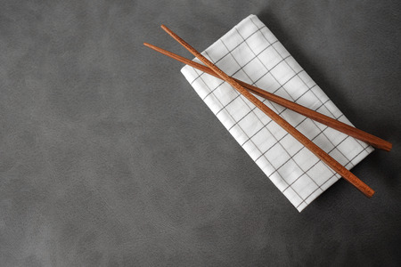 Collection of wooden chopsticks on gray backgroundの写真素材