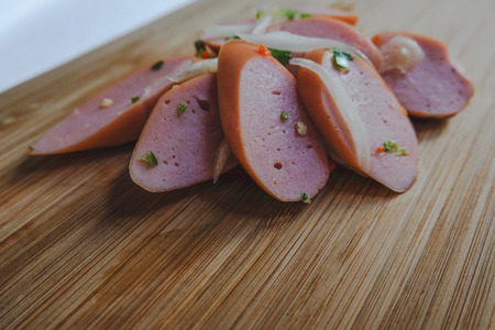 Sausage spicy salad with onion, spring onion and corianderの写真素材