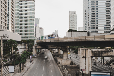 Dec 10, 2018: Sathorn road through the downtown Bangkok city Thailand and full of stores, residential and office building with BTS skyrailのeditorial素材