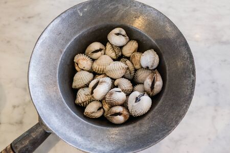 Fresh cocklesâ shellâ boiledâ isâ aâ healthy dietâ menuâ top view thai foodの写真素材