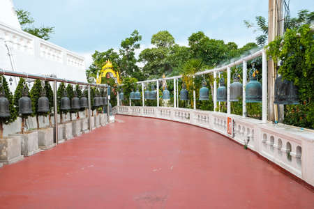 Bangkok, Thailand - July 10, 2020 : Wat Saket, Temple of the Golden Mount amid the clear blue sky with little clouds, Bangkok, Thailand Row of Thai style bells in buddhist temple, Golden Mount templeのeditorial素材