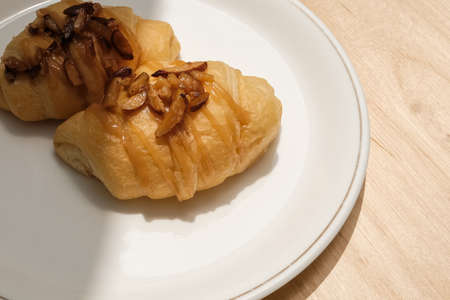 Butter croissants with sliced almonds topping caramelized for breakfast in the morning