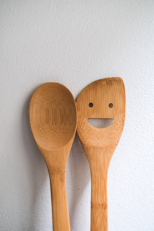 Set of wooden kitchen utensils, spoon and spatula in ceramic glassの写真素材