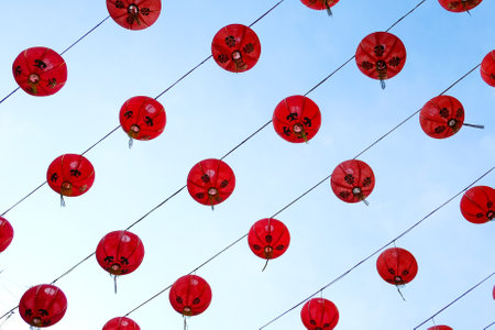 Atmosphere chinese new year festival decorated with red lanterns hanging in the sky on Yaowarat Road, Bangkok, Thailand.の写真素材