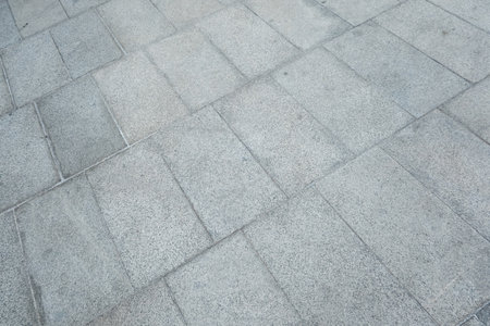 Vintage dark grey brick background, old rustic empty concrete floor.の写真素材