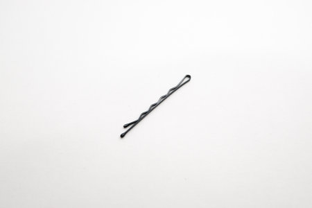 Black hairpin on white background.