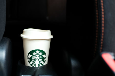 BANGKOK, THAILAND - March 03, 2023: Starbucks coffee cup in a car, Starbucks is one of the popular American coffee company and coffeehouse chain.のeditorial素材