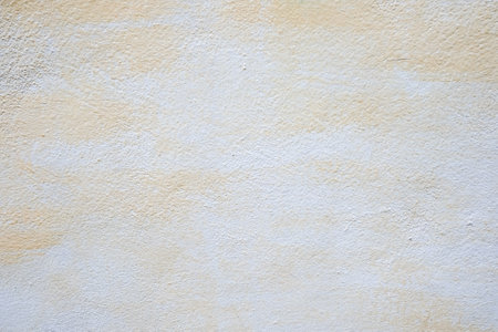 yellow paint marks on a brick wall.の写真素材