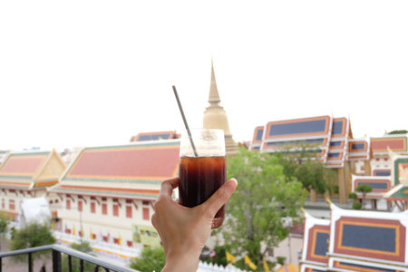 Fresh espresso coffee mix coconut juice with temple bangkok background.