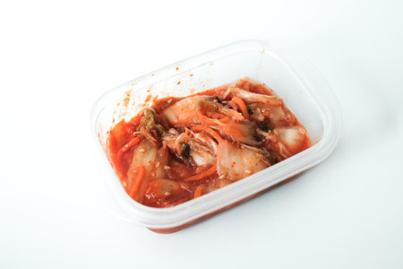 kimchi korean ready to eat in plastic box on white table.の写真素材