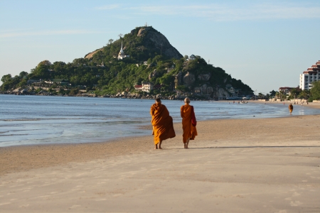 monk Alms round on the beach.in sun rise day and has mountain as backgroundの写真素材