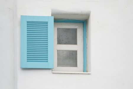 blue Windows on white wallの写真素材