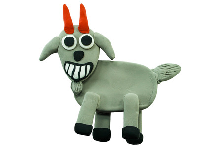 Smiling goat made from plasticine on white backgroundの写真素材