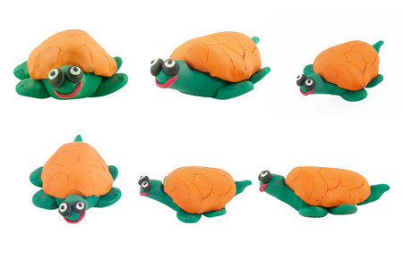 Set of yellow turtle made from plasticine on white backgroundの写真素材