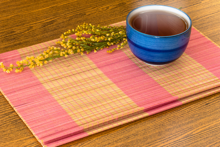 Relaxing Chinese Tea cup on bamboo mat still life styleの写真素材