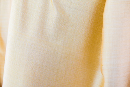 Gold silk fabric texture backgroundの写真素材