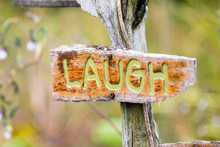 Brown Laugh wood sign in natureの写真素材