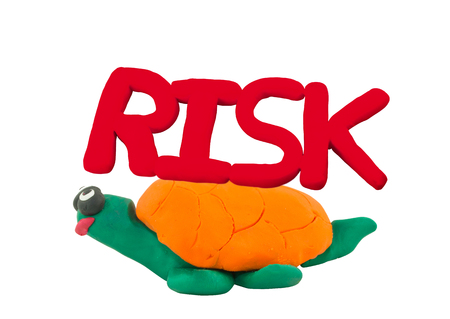 Plasticine red risk on yellow turtle concept slow riskの写真素材