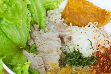 chinese food , noodle soup with sliced pork