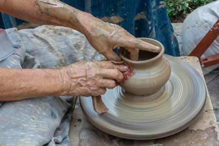 women showing carve clay for make smooth textureの写真素材
