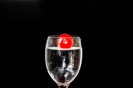 Tomatoes falling waterの写真素材