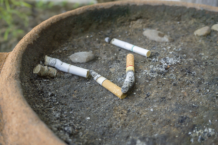 Cigarette in the dump, no smoking.の写真素材