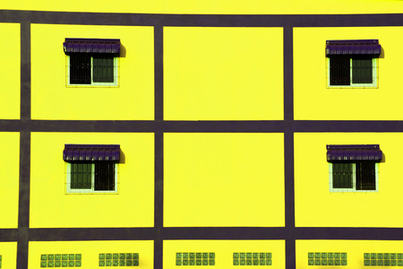 Window on the yellow wallの写真素材