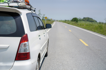 White car parked by the road,travel concepts or travel.                     の写真素材