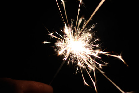Children are playing fireworks as a beautiful light.の写真素材