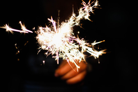 Children are playing fireworks as a beautiful light.の写真素材