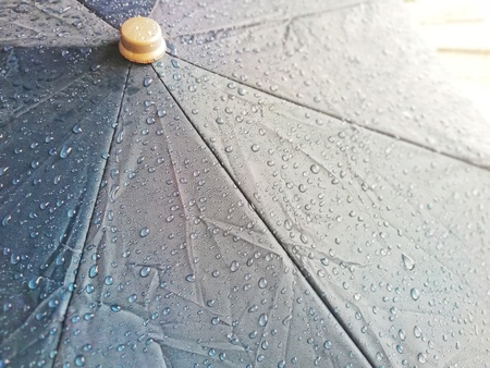 Rain umbrellas that are wet rain stains on the umbrella.