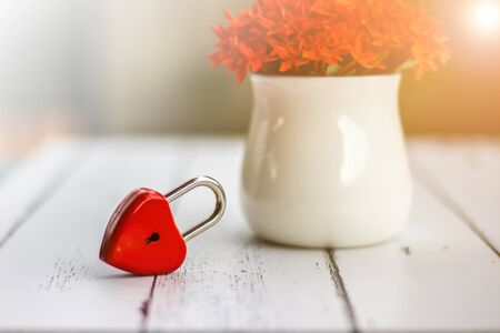 Red hearts and flowers on a white wood floor with space, ideas love or the day of love Valentines Day.の写真素材