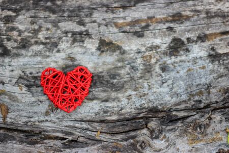 Red heart on old wooden floorの写真素材