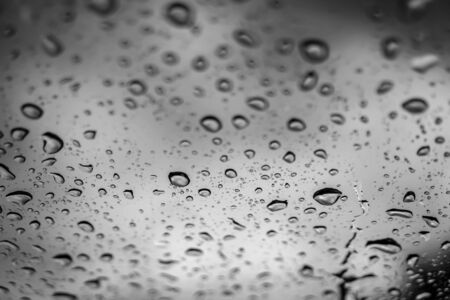 blur backgruond,Rain water on the car glass
