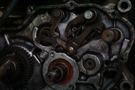 Old gears and old nut on wooden tables