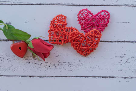 Roses and Red Keys on wood table Valentine's Day concept and the day of love