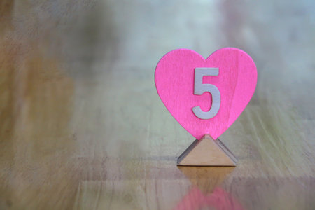 Pink wood hearts are on the wooden table and copy space,Valentines day ideas.の写真素材