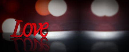 Red love on the table and bokeh lights in the background, Valentine's Day concept.の写真素材
