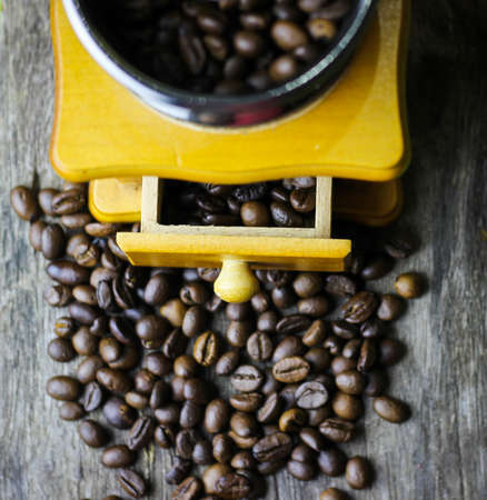 coffee beans on old wooden floorの写真素材