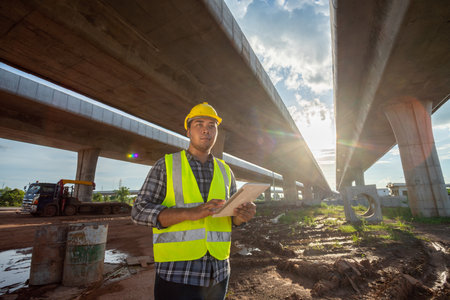 Asian engineering inspected the structure road construction work at road construction.の写真素材