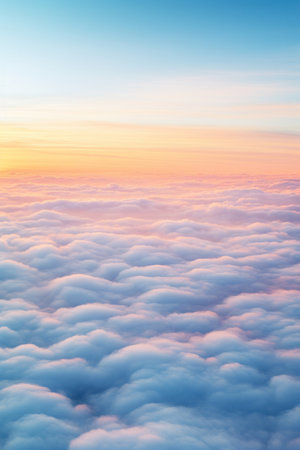 Aerial view of Beautiful sunrise sky above clouds or fog with dramatic light at dawn.の素材